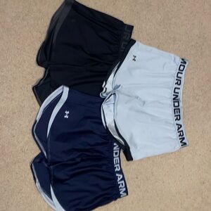 Three Under Armour athletic Shorts